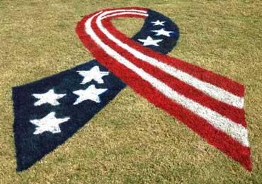 American flag ribbon stencil red white blue aerosol paint for baseball field.