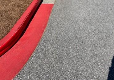 easy to install curb protection 10 foot plastic strips and bright red curb painting.