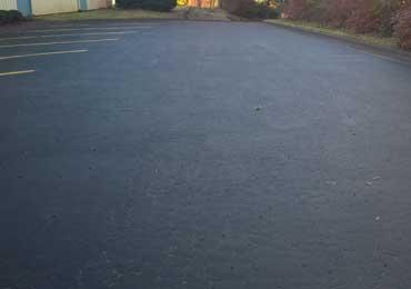 Fast dry asphalt seal coating that is flexible with no tracking and no odor.
