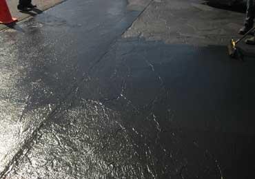 Flexible asphalt crack filler road repair coating durable.