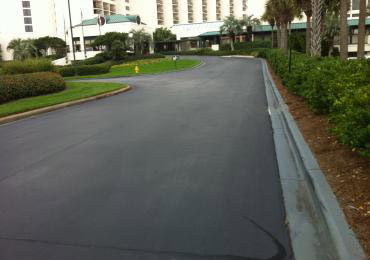Gray curb paint asphalt coating driveway sealer.