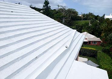 application of white heat reflective paint roof coatings in bermuda hot climate.