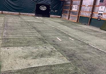 old synthetic used turf with permanent sewed in line getting painted with permanent green paint.