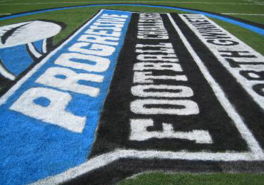 Bright Blue colors athletic field paint logo grass painting.