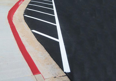 Parking lot red white line striping marking paint.