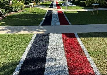 US flag colors painted using USSC red white blue athletic field marking paint