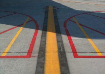 Bright reflective airport lines lanes marking striping sign numbers legend paint painting.