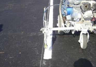 Spray application white cold applied liquid thermoplastic traffic line marking paint.