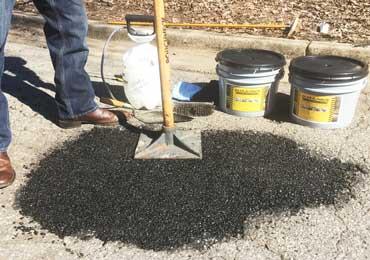 Hand tamper tool to compact asphalt cold patch repair product in pot hole.