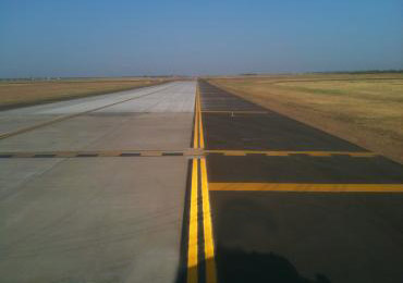 Airport runway yellow paint.