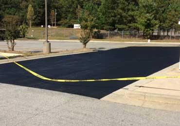 Black top sealer asphalt sealcoating used by municipalties town halls.