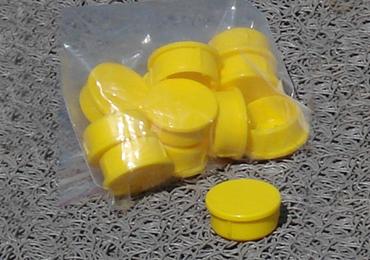 yellow color caps ground sockets athletic field ground markers.