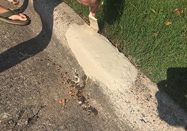 repairing missing broken street curb