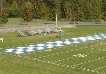 Bright football field end zone paint.