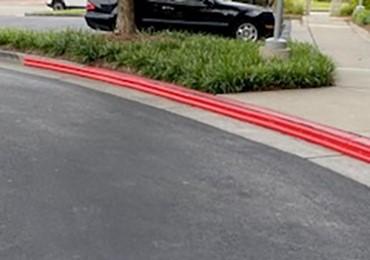 parking lot parking deck curb protection 10 foot ten strips in colors direct from manufacturer.