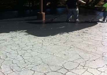 Repair seal coat asphalt non shrink flexible crack filler sealer.