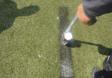 spray remover on paint lines to be removed on synthetic field turf.
