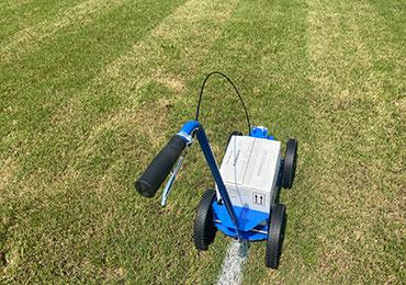 Pro Liner aerosol can line striping machine for football field lines.
