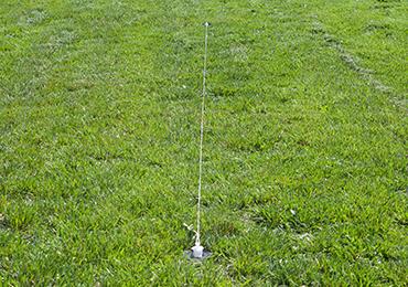 string guide to paint straight lines on soccer field ground markers.