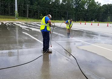 surface preparation pressure washing of old traffic line paint.