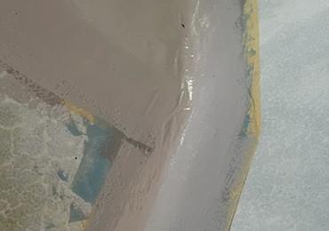 painting of concrete pool using chlorinated rubber pool paint.