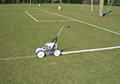 Soccer Field white lines sprayed aerosol can machine.