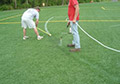scrub agitate remover paint lines rinse off painted lines synthetic turf fields.