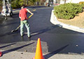 application of asphalt sealer repair coating.