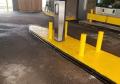 bank drive through protected with curb huggers yellow paint.