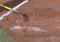 wet water spots rain puddles baseball dirt infield.