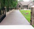 Residential concrete driveway repaired painted with stampcrete water based coating.