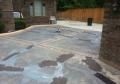 Residential driveway patched with latex coating before painting.