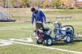 Athletic Football Field Line marking Stencil Painting with Graco ride on machine USSC athletic field marking paints.