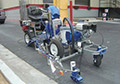 Graco ride on traffic line marking striping painting machine.