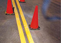 High solids yellow cold applied liquid thermoplastic traffic line marking paint.