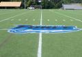 Team Logo painted removable paint on synthetic turf with custom logo stencil.