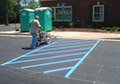 Parking lot line striping marking blue paint.