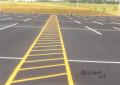 Parking lot striping yellow marking paint.
