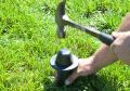 Rubber mallet or hammer to push plastic marker down in the ground.