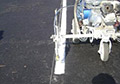 Spray application white cold applied liquid thermoplastic traffic line marking paint.