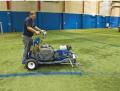 Ride on self propelled traffic lines athletic field striping machine.