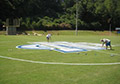 Connecting dots, connecting line and outlines and filling in paint to finish football field midfield logo.
