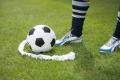 Soccer free kick vanishing foam aerosol can spray line referee marking.