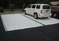 White asphalt parking lot driveway coating to reflect heat keep earth cool lower green house effect