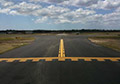 Yellow airport runway marking paint.