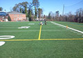 painting durable removable yellow lacrosse lines on synthetic field turf.