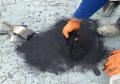 brush polymer coating paint overlay then apply sand to repair thin layers of asphalt concrete.