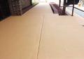 mocha-french roast red brown color concrete paint overlay coating on concrete walkway.