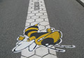 custom logo painted concrete street asphalt road.
