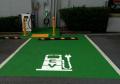 Electric charging station space green paint white line paint EV stencil.